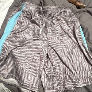 2 pairs men’s Champion athletic shorts,size medium, 1 is teal, 2nd is gray&teal